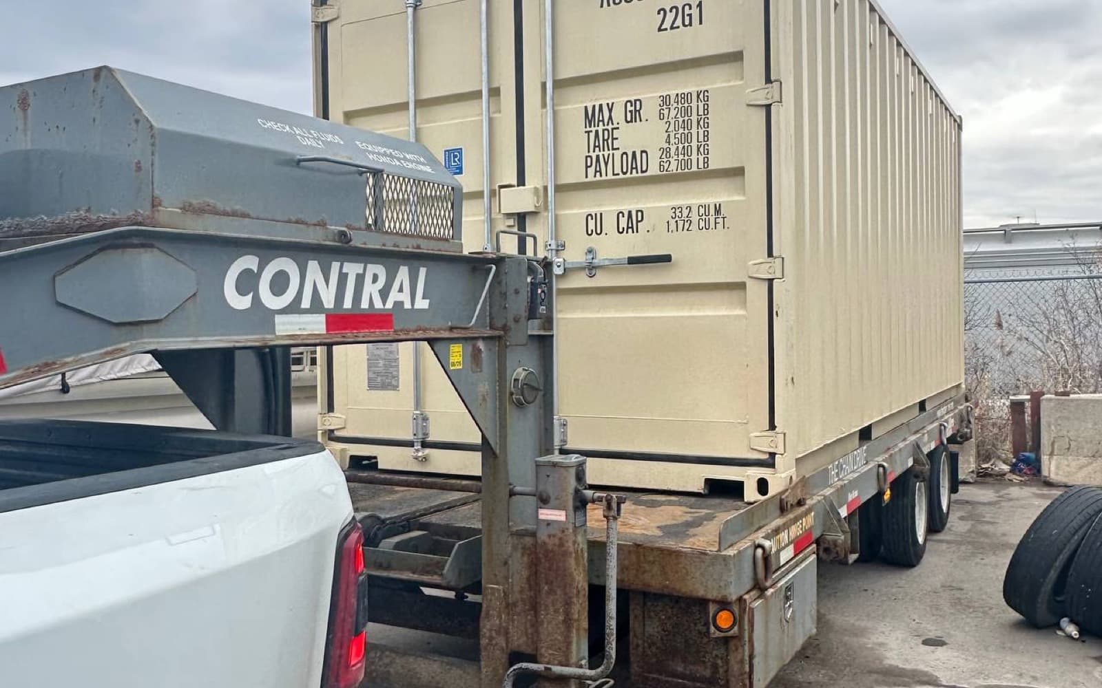 Shipping container delivered by truck across Ontario