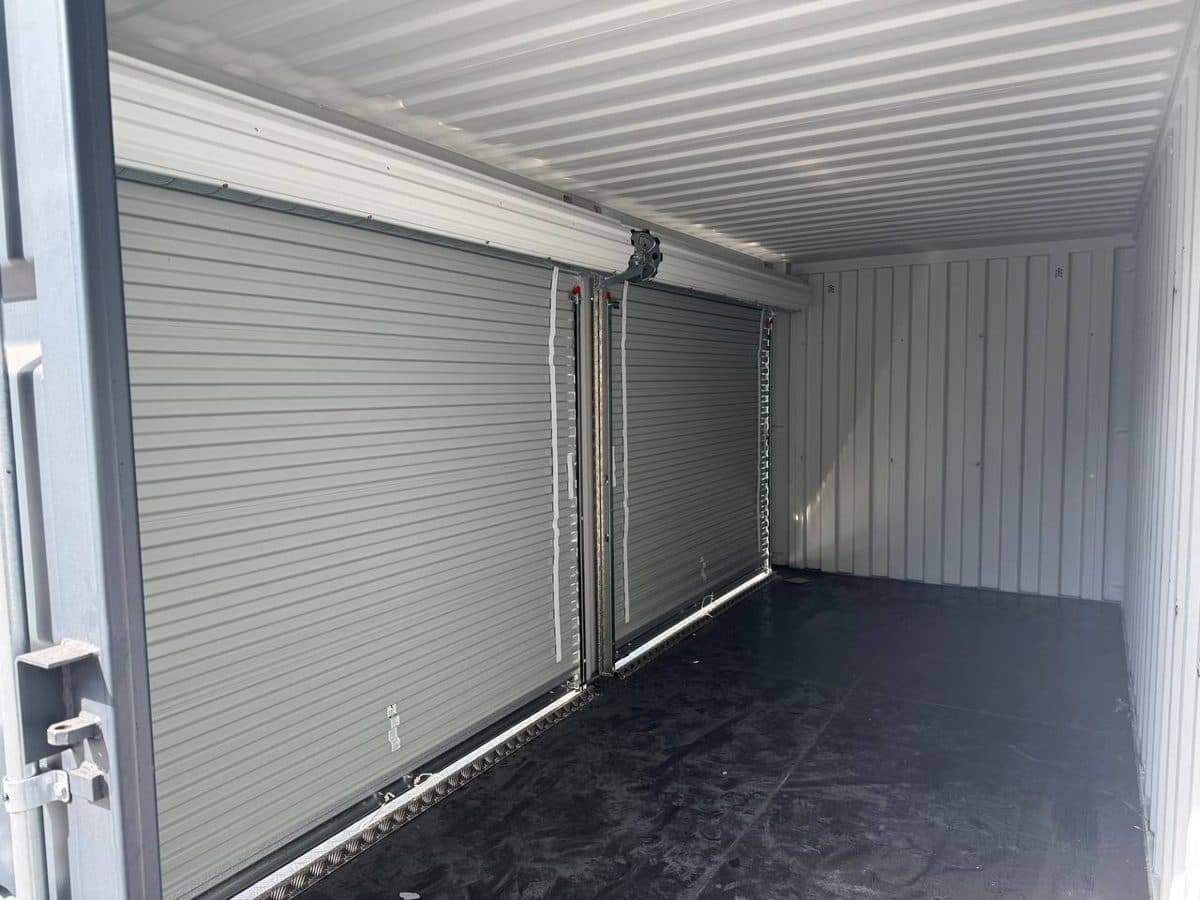 Inside: plywood floor & roll-up doors